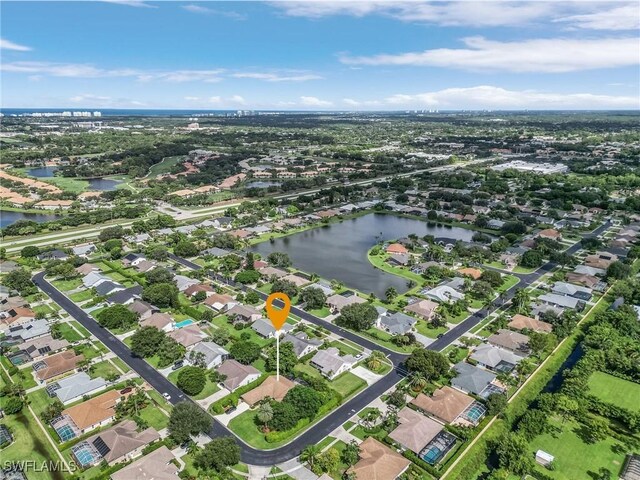 aerial view featuring a residential view and a water view