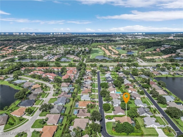 bird's eye view with a residential view and a water view