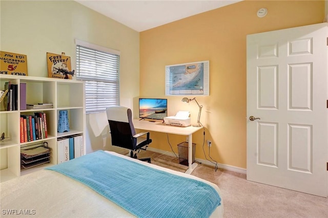 bedroom featuring carpet and baseboards