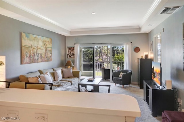 living area with ornamental molding, visible vents, and light colored carpet