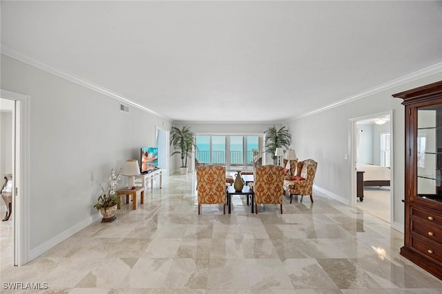 unfurnished dining area with crown molding, visible vents, and baseboards