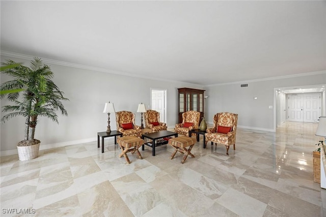 living area with visible vents, crown molding, and baseboards