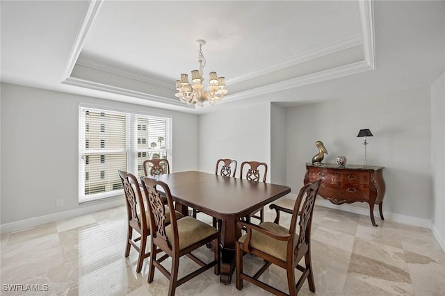 dining room with baseboards, a tray ceiling, crown molding, and an inviting chandelier