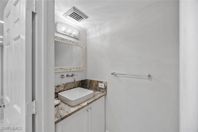 bathroom with visible vents and vanity