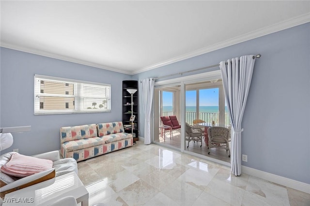 living room with ornamental molding, a water view, plenty of natural light, and baseboards