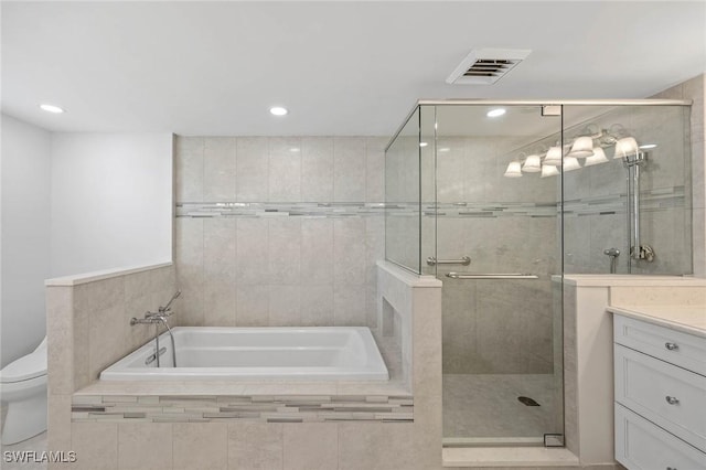 full bathroom featuring a garden tub, vanity, visible vents, and a shower stall