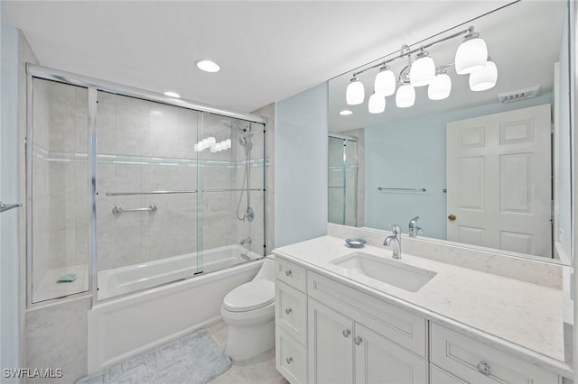 bathroom with visible vents, toilet, tile patterned flooring, combined bath / shower with glass door, and vanity