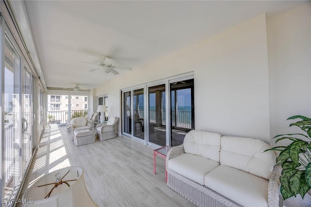 sunroom / solarium with ceiling fan