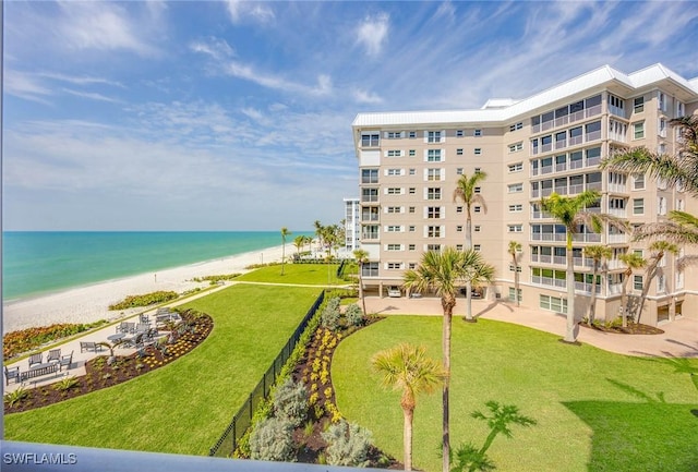 exterior space with a beach view and a water view