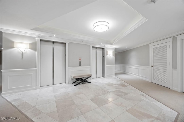 interior space with ornamental molding, a decorative wall, a wainscoted wall, and elevator