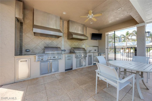 view of patio / terrace featuring ceiling fan, exterior kitchen, outdoor dining area, and area for grilling