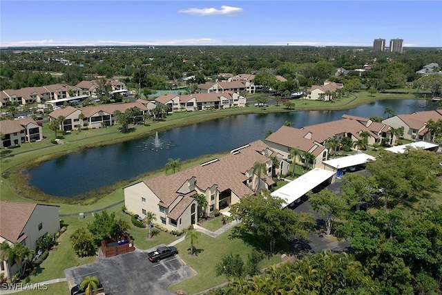 aerial view featuring a residential view and a water view