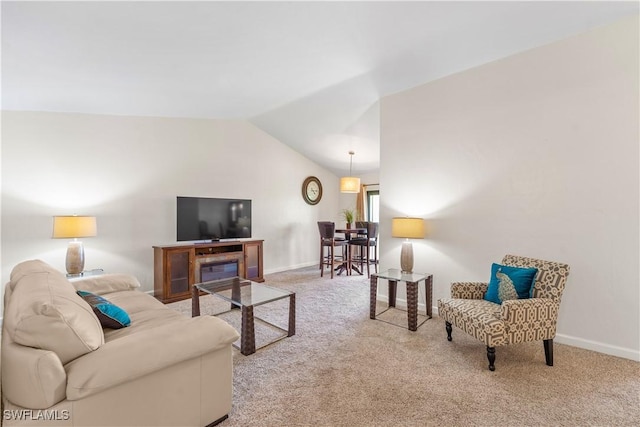 living room with carpet, baseboards, and vaulted ceiling