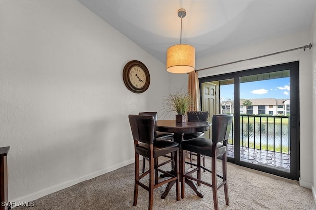 dining room with light carpet and baseboards