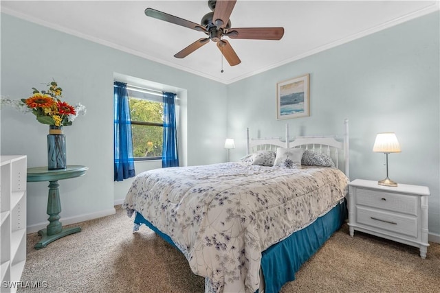 carpeted bedroom featuring ceiling fan, ornamental molding, and baseboards