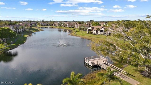 birds eye view of property featuring a residential view and a water view