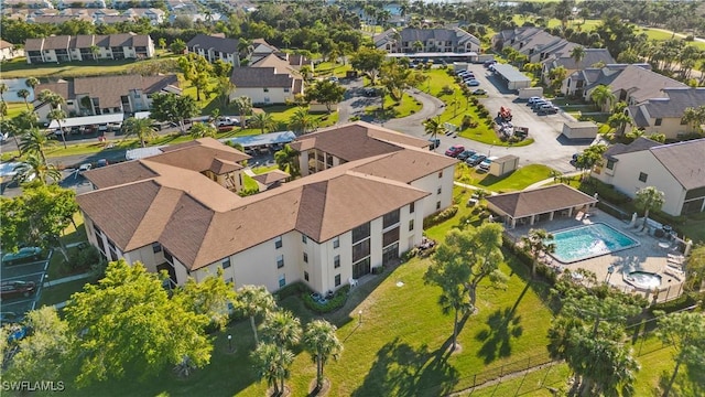 birds eye view of property with a residential view