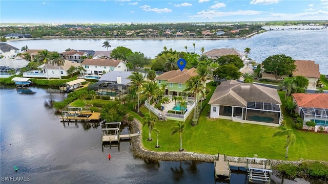 bird's eye view featuring a water view and a residential view