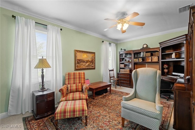 living area featuring plenty of natural light, visible vents, ornamental molding, and ceiling fan