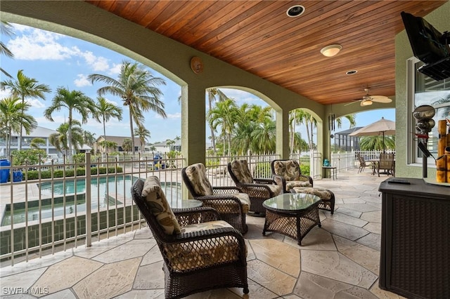 view of patio / terrace featuring fence, an outdoor hangout area, and a fenced in pool