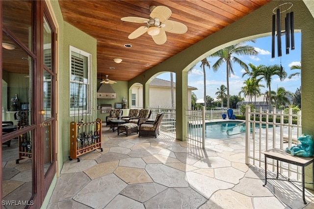 exterior space with wooden ceiling and ceiling fan