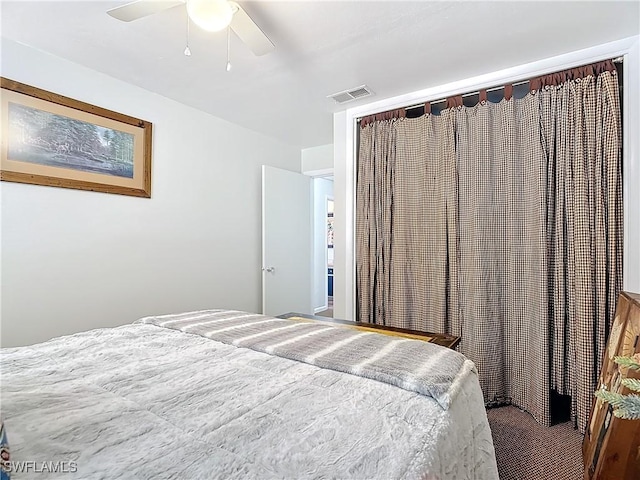 bedroom featuring visible vents and a ceiling fan