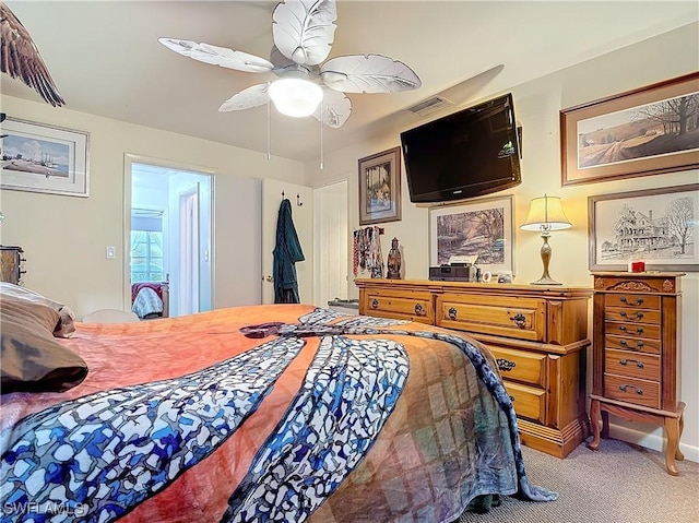 carpeted bedroom with ceiling fan and visible vents