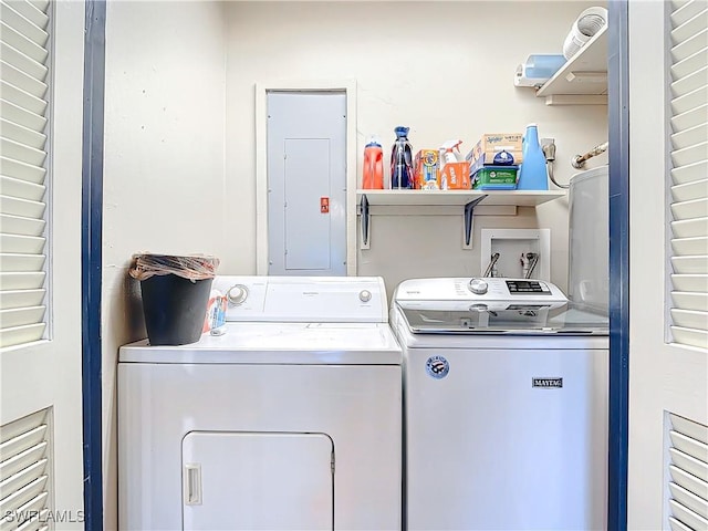 laundry room with laundry area, electric panel, and separate washer and dryer