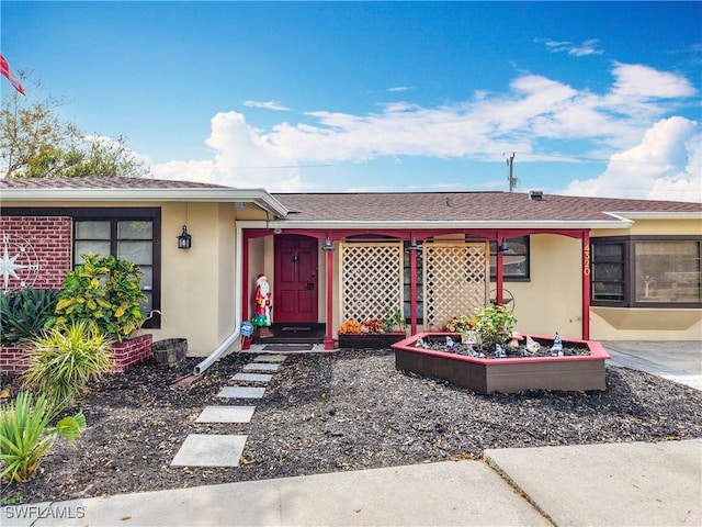 ranch-style house with stucco siding