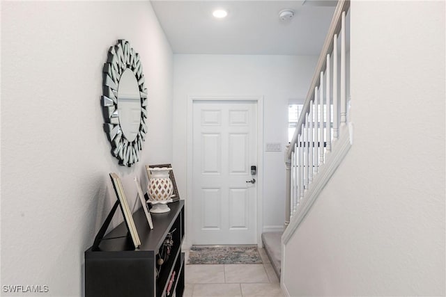 14239 Oviedo Pl, Fort Myers, FL 33905 - doorway to outside featuring light tile patterned flooring and stairway