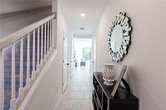 14239 Oviedo Pl, Fort Myers, FL 33905 - corridor with stairs, visible vents, and light tile patterned flooring