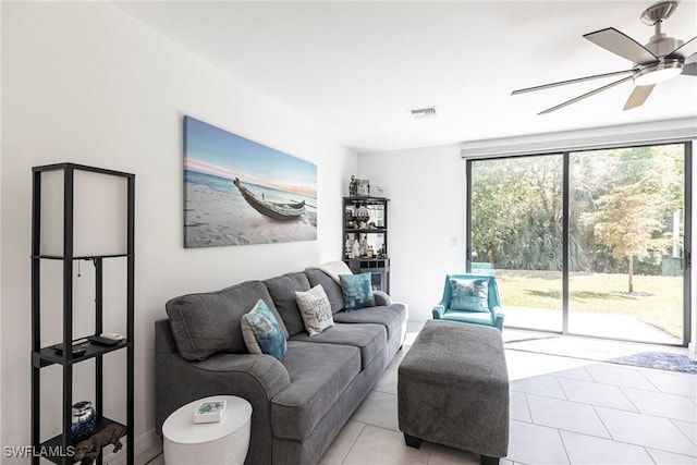 14239 Oviedo Pl, Fort Myers, FL 33905 - living area with ceiling fan, light tile patterned floors, plenty of natural light, and visible vents