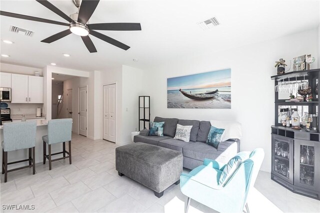 14239 Oviedo Pl, Fort Myers, FL 33905 - living room featuring a dry bar, ceiling fan, visible vents, and recessed lighting