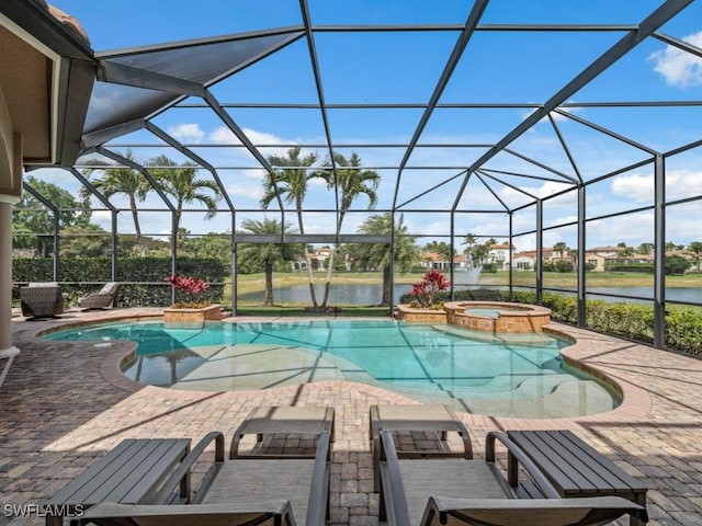 view of pool featuring glass enclosure, a patio, a water view, and a pool with connected hot tub