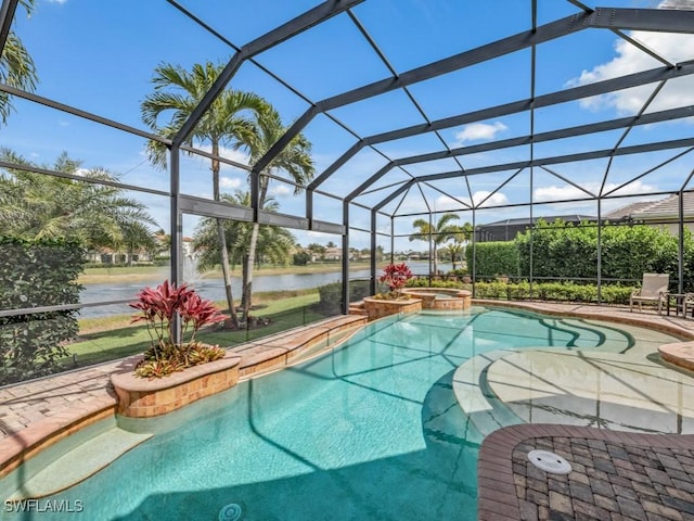 view of swimming pool featuring a lanai, a patio area, a water view, and a pool with connected hot tub