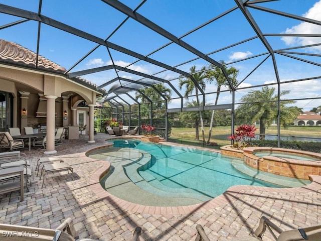 view of pool featuring a patio area, glass enclosure, and a pool with connected hot tub