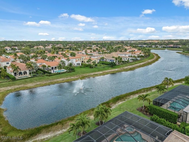 birds eye view of property with a residential view and a water view