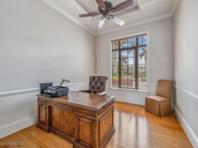 office with wainscoting, crown molding, and light wood-style flooring