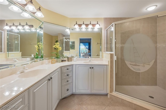 full bathroom with tile patterned floors, a shower stall, double vanity, and a sink