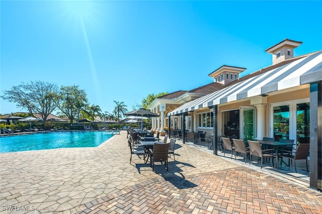 pool with a patio area