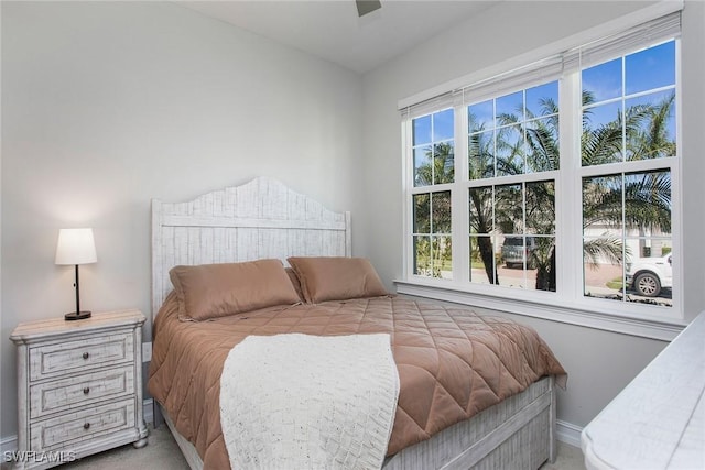 carpeted bedroom with baseboards