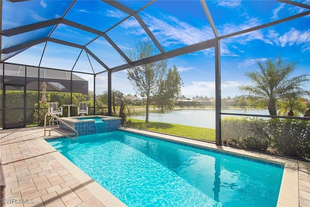 view of swimming pool featuring glass enclosure, a water view, and a patio area