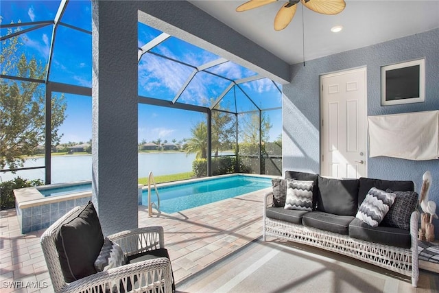 pool with a patio, a ceiling fan, a hot tub, outdoor lounge area, and a lanai