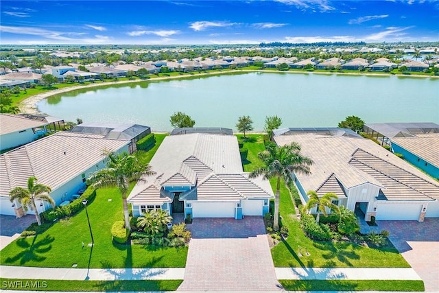 birds eye view of property with a residential view and a water view