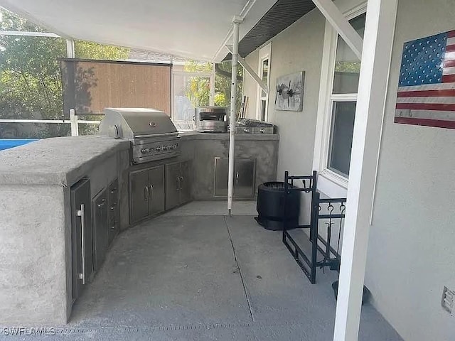 view of patio / terrace with an outdoor kitchen and grilling area