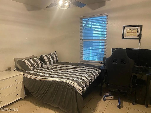 bedroom featuring light tile patterned floors and ceiling fan