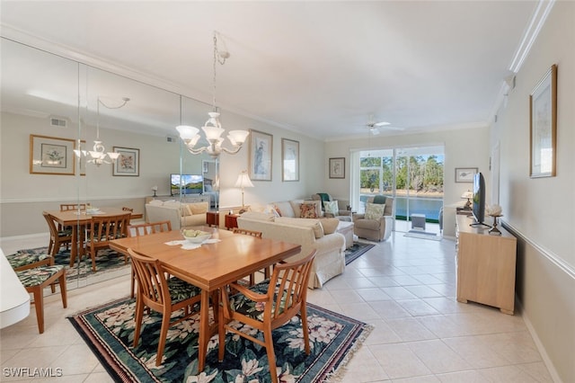 dining space with visible vents, ornamental molding, ceiling fan with notable chandelier, light tile patterned floors, and baseboards