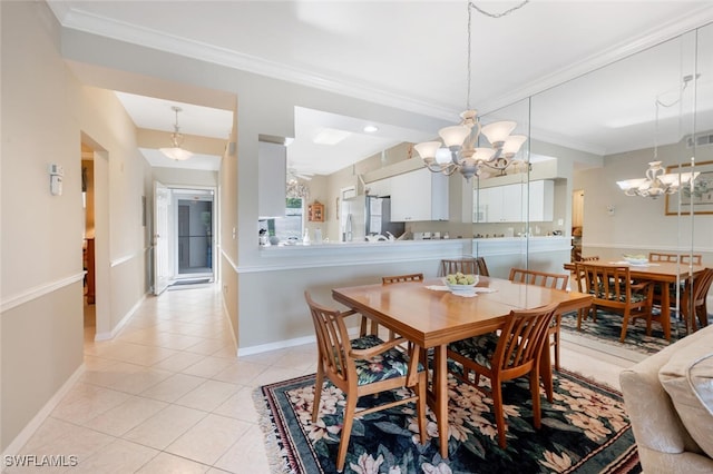 dining area featuring light tile patterned floors, baseboards, a chandelier, and crown molding