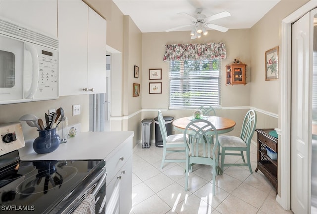 dining room featuring light tile patterned flooring and ceiling fan