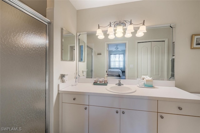 bathroom featuring vanity, ceiling fan, a stall shower, and connected bathroom